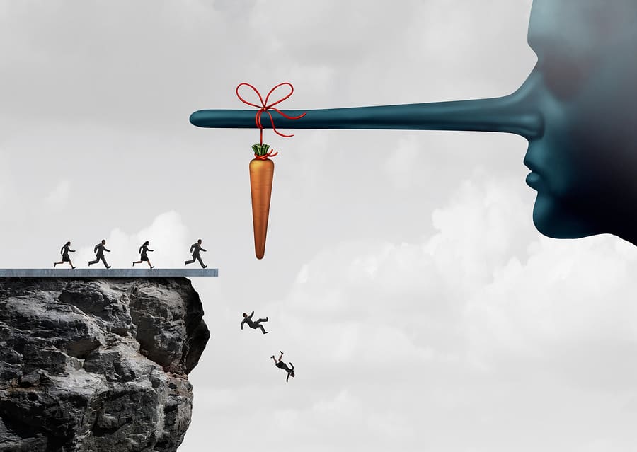 Incentive trap and corrupt leader business concept as a group of people running towards a carrot tied to a liar nose only to have been tricked and fooled into fall off a cliff as a metaphor for entrapment or bait trapping in a risky economy.