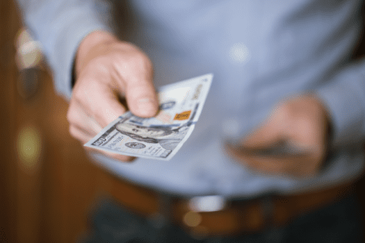 businessman-holding-money-in-his-hands-P3Q6XEP