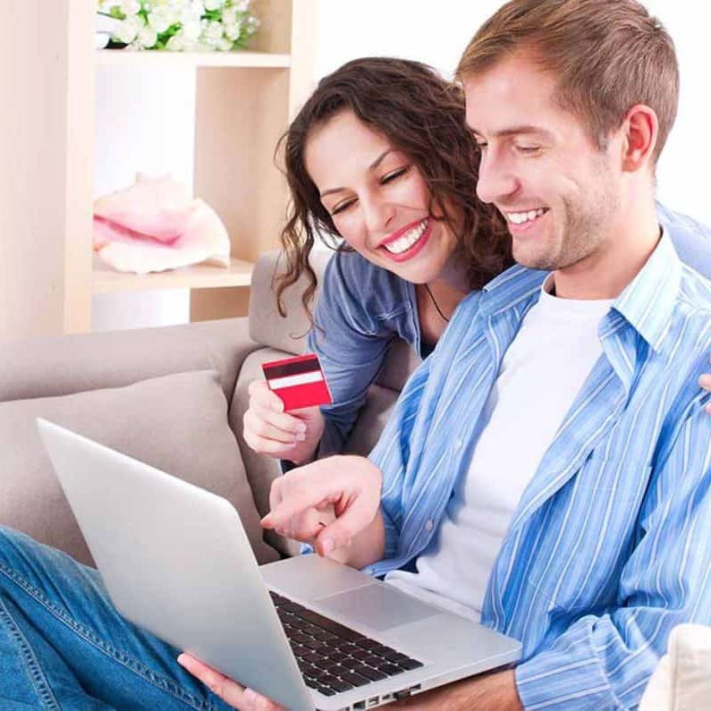 womanandmanbuyingfromcomputerwithcreditcard1